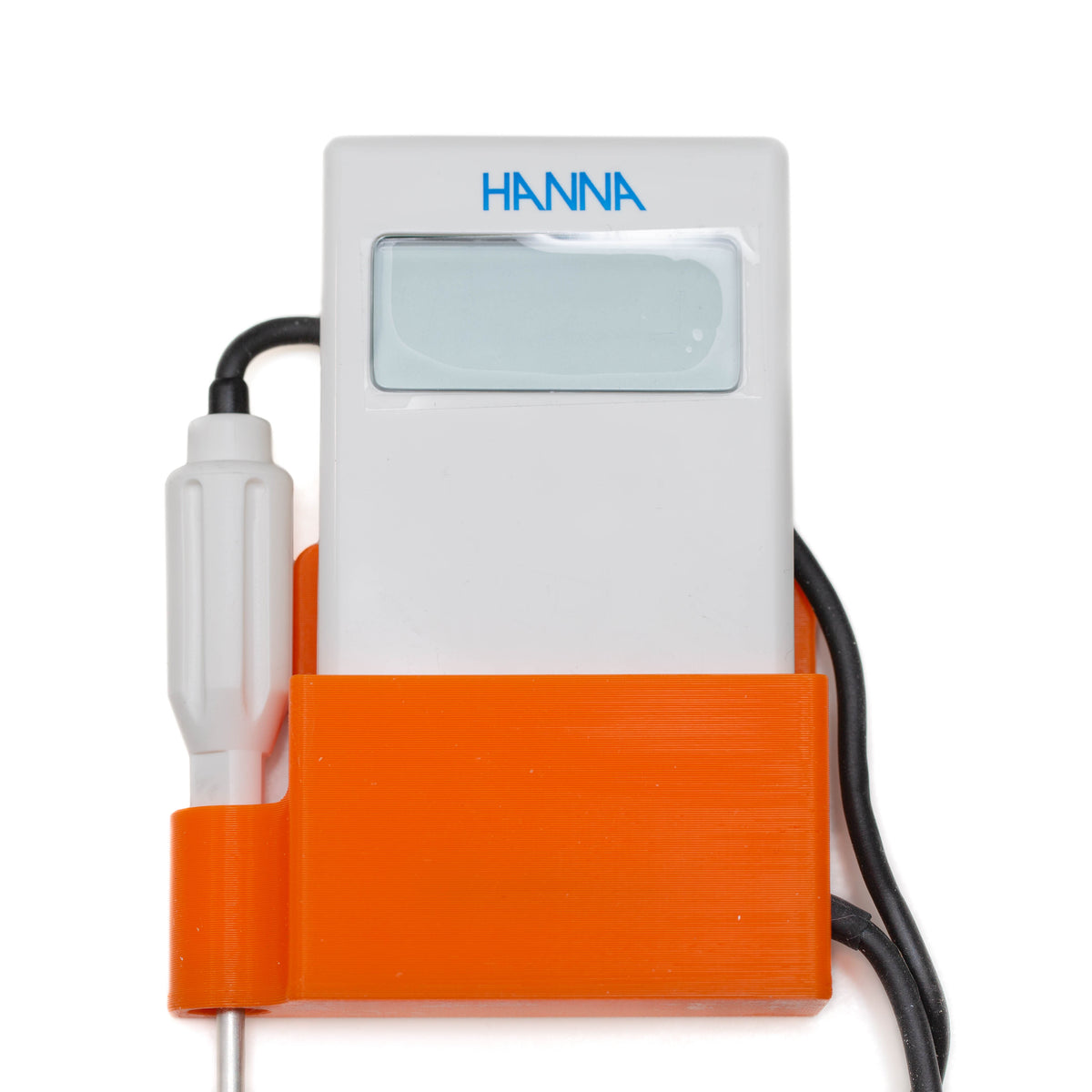 Orange mount holding a Hanna thermometer on the wall